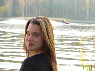 Redhead girl in autumn forest