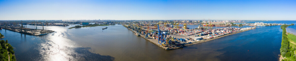 Aerial view of cargo ship, cargo container in warehouse harbor in the Morskie Vorota district in St. Petersburg © miklyxa