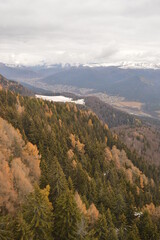 Fototapeta premium Hiking in the misty and dramatic Carpathian Mountain range in Romania, Eastern Europe