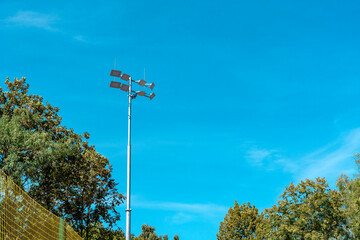 Searchlights. Lighting of the football field, soccer stadium. Lighting mast on a background of a blue sky. spotlights