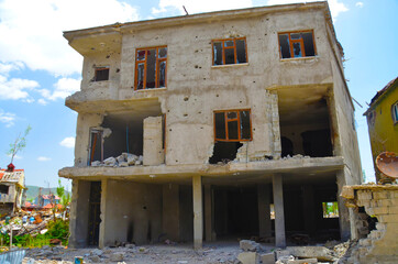 scars of war and conflict, a ruined building, a house
