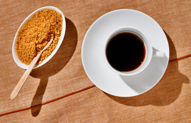 Cup of coffee with brown sugar