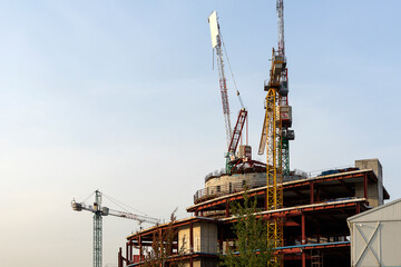 Fototapeta na wymiar construction of a shopping center. construction cranes are working