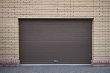 Brick wall and modern automatic garage door