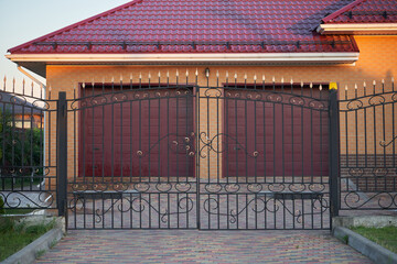 Transparent metal forged gate for entering a private house