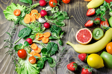 Healthy eating, healthy vegetarian food, fresh organic fruit and vegetable on wooden table