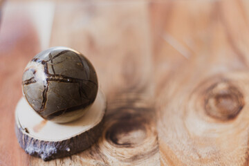 Close up photo of a ball-shaped semi precious stone