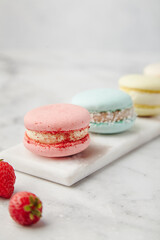 French cake macarons on a marble background