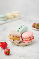 French cake macarons on a marble background