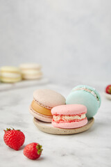 French cake macarons on a marble background