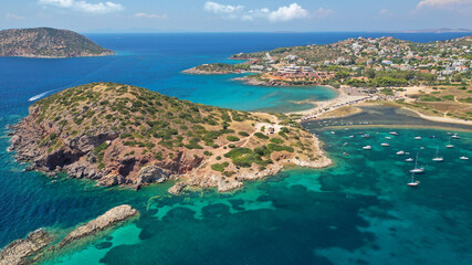 Aerial drone photo of famous islet, beach and bay of Agios Nikolaos in Anavysos area with crystal...