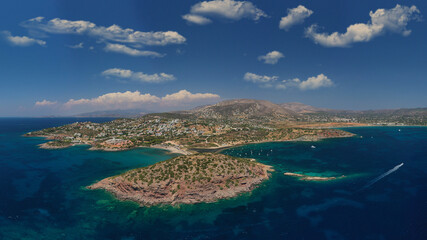 Fototapeta na wymiar Aerial drone photo of famous islet, beach and bay of Agios Nikolaos in Anavysos area with crystal clear emerald sea, Athens riviera, Attica, Greece