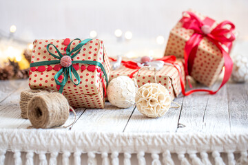 Fototapeta na wymiar Beautiful Christmas background with Christmas toys and a gift box.