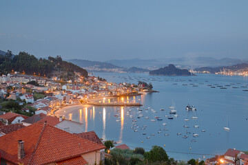 Naklejka premium Aerial view at sunset of a coastal town in the Galicia area called Raxó