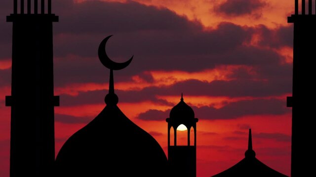 Silhouette of a mosque on a background of sunrise.