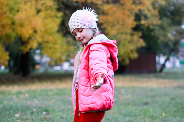 girl in red clothes posing on the background of nature