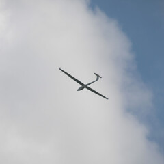 A drone is flying in the middle of the sky monitoring the situation below
