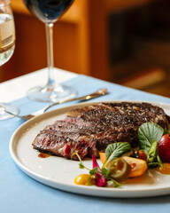 Ribeye beef steak with fresh vegetable salad