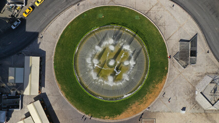 Aerial drone photo of recently renovated Omonoia square featuring huge round fountain, Athens centre, Attica, Greece