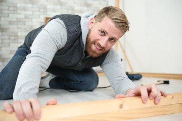 young carpenter working in building