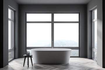 Fototapeta na wymiar Stylish gray bathroom interior with tub and windows