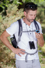 male rambler looking at compass