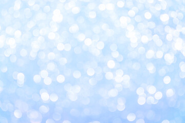 Beautiful blue abstract background with bokeh defocused lights.Winter Christmas and New Year background.