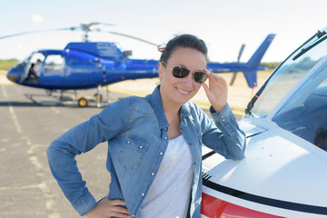 portrait of woman leaning on aircraft © auremar