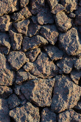 Rough granite stones. The texture of the stone wall. Great for background and design.