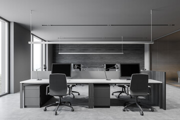 Stylish gray and wooden workplace in open space office