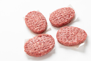  Raw minced homemade cutlets, on the white background