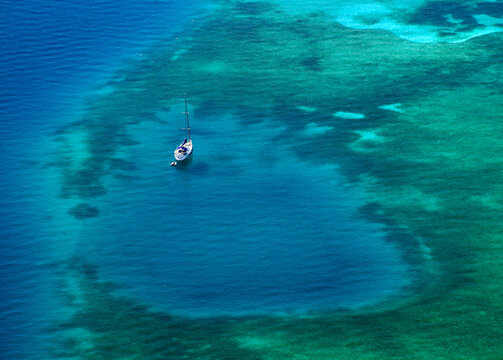 White Yacht Coral Reef In Beautiful Bay Sea. Aerial View.