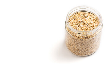 Jar of oat flakes isolated on white background