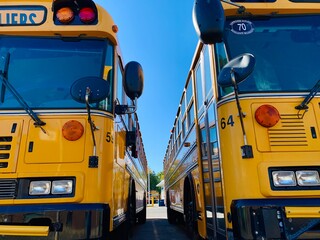 Montreal school bus parking at the terminal. Driver’s must stop on signal with red light flashing. School reopen - safety measures during COVID-19