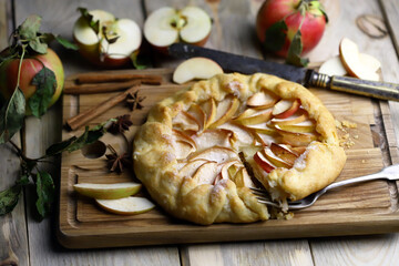 Selective focus. Galette with apples. Rustic style. Autumn pastries.