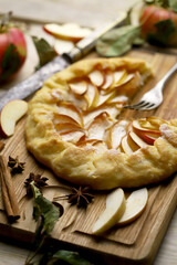 Selective focus. Galette with apples. Rustic style. Autumn pastries.