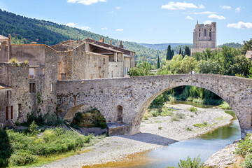 Fototapeta na wymiar Old Bridge (Pont Vieux) with the Abbey of St. Mary of Lagrasse, France