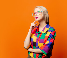 Style blonde in 90s clothes and rainbow glasses