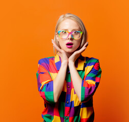 Style blonde in 90s clothes and rainbow glasses