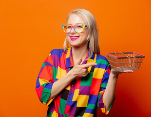 Style blonde in 90s clothes with shoping basket