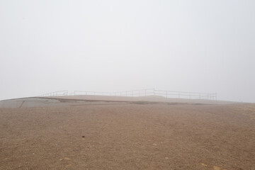 Foggy view at nightfall at battery spencer