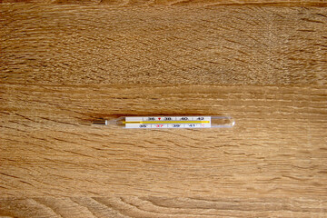 Thermometer for measuring temperature on a table.