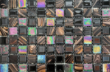 Black, brown and mother-of-pearl ceramic tile mosaic .