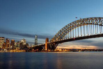 Fototapeta na wymiar Sydney Harbour Bridge at sunset with new casino in the background