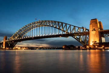 Fototapeta na wymiar Iconic Sydney Harbour Bridge at sunset with blue sky 