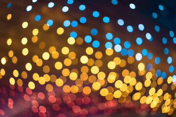Texture of colorful shining bokeh on a dark background.