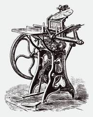 Antique foot-treadle platen printing press in three quarter view