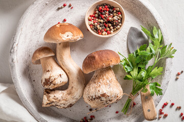Preparations for homemade risotto with boletus mushrooms and parsley