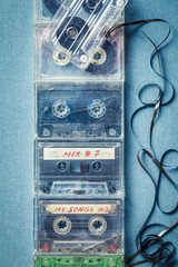Several cassette tapes with an extracted tape