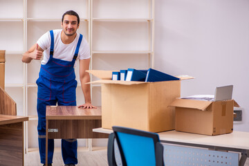 Young male professional mover doing home relocation